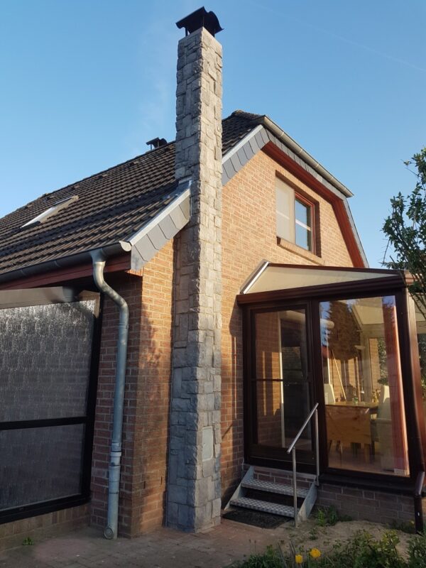 kaminverkleidung aussen mit burgmauer basalt verblender und ecken